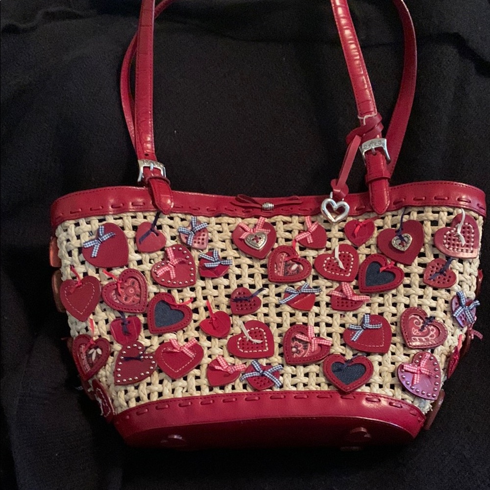 Brighton straw tote with hearts.